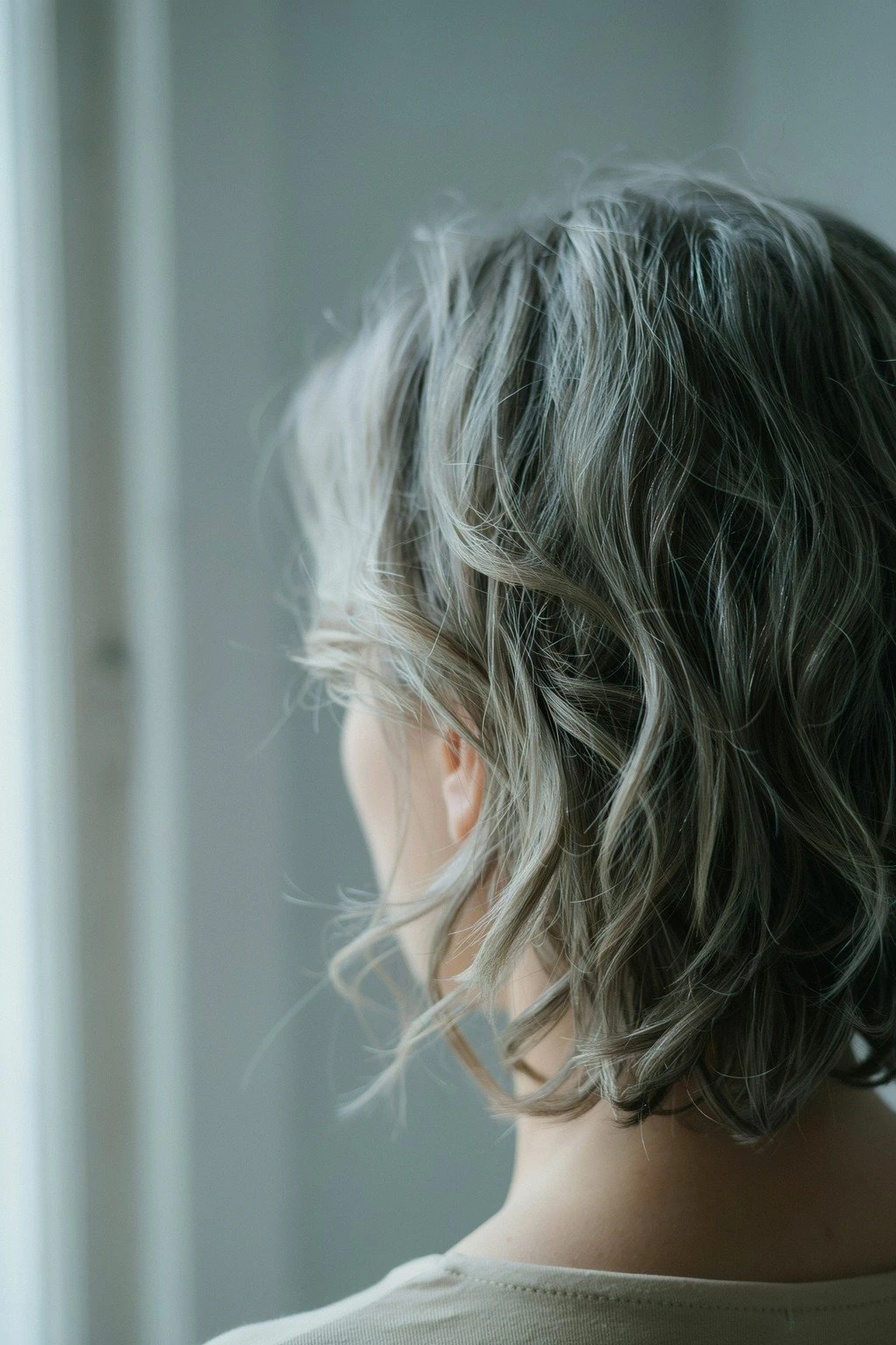 A soft textured crop air-dried into its natural pattern, seen from behind