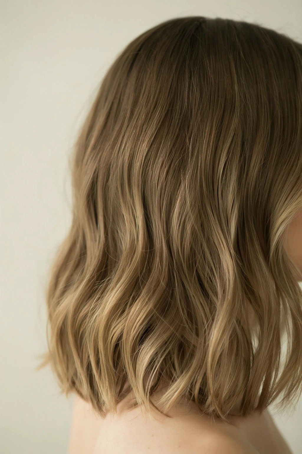 Medium brown hair with buttery blonde highlights woven from root to end, bright and evenly blended