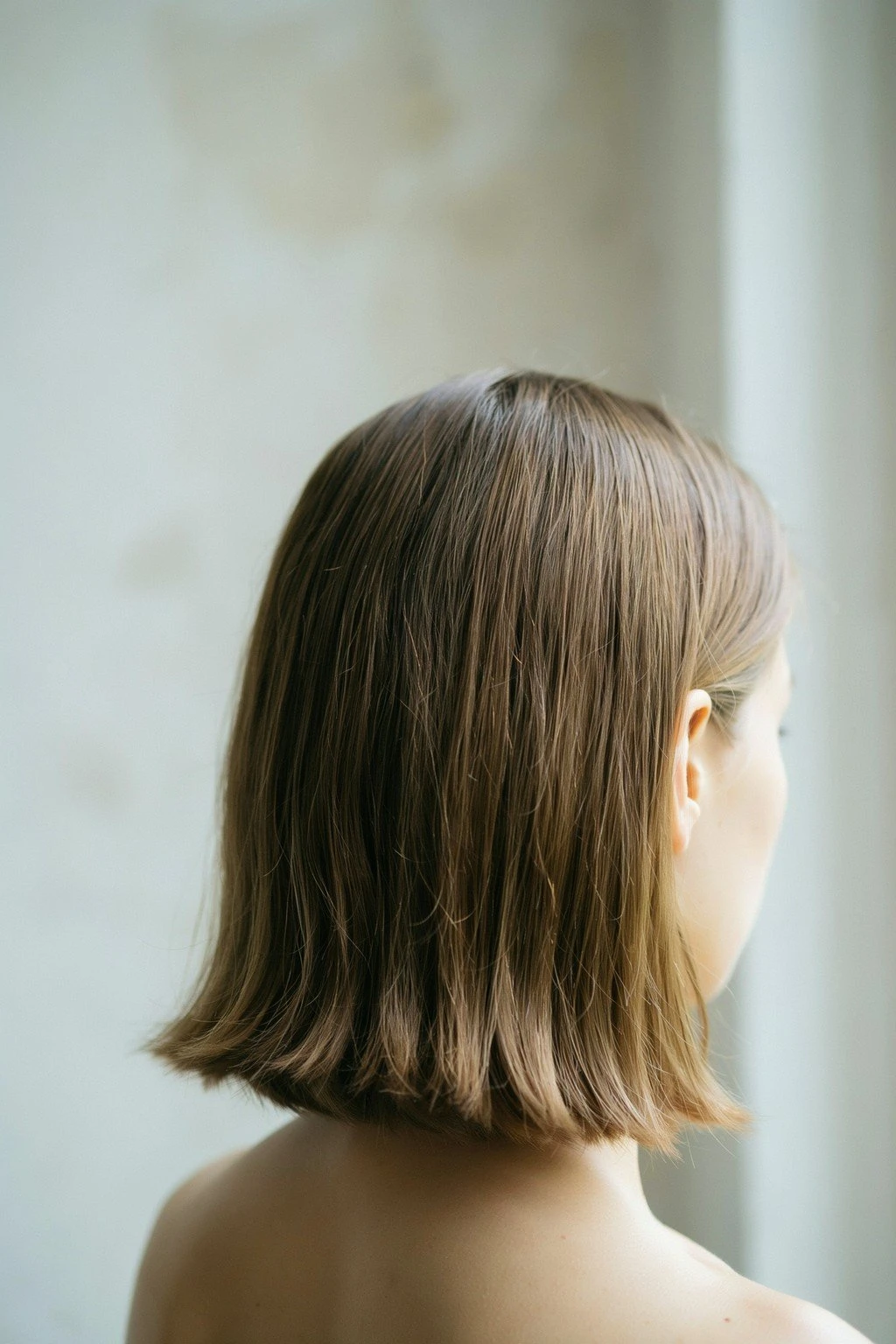 Woman with a bob haircut ending just below the jaw